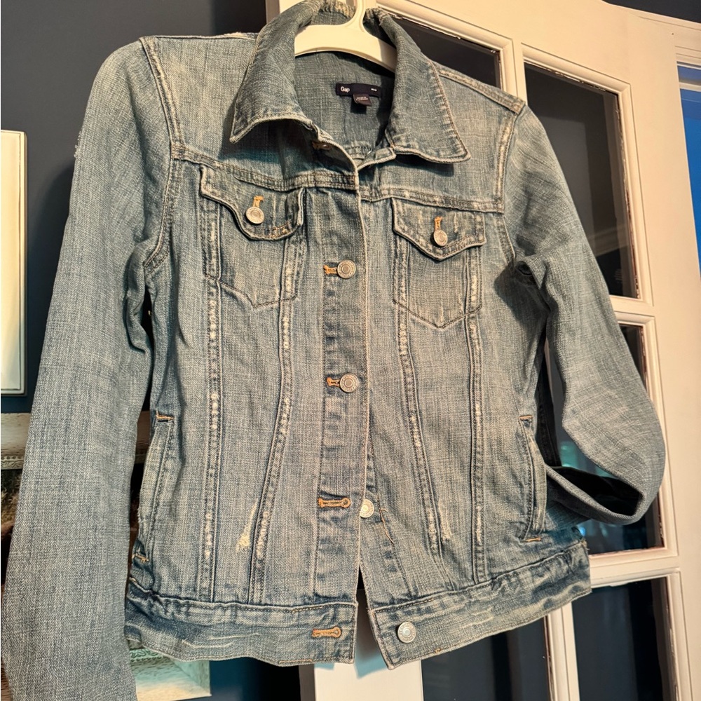 Women’s Gap distressed denim jacket in size M.